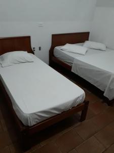 En eller flere senge i et værelse på Unihotel