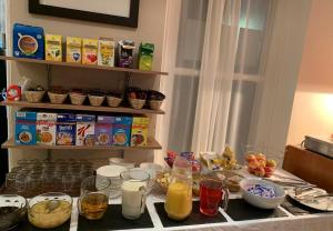 a kitchen counter with some food and drinks on it at Four Seasons Budget in Aberystwyth