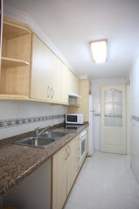 Kuchyň nebo kuchyňský kout v ubytování Apartamento caribe