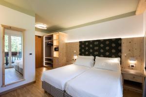 Posteľ alebo postele v izbe v ubytovaní Hotel Medil