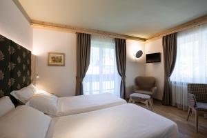 Posteľ alebo postele v izbe v ubytovaní Hotel Medil