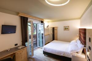Posteľ alebo postele v izbe v ubytovaní Hotel Medil