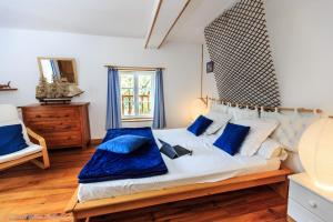 A bed or beds in a room at Domaine de Beaufort