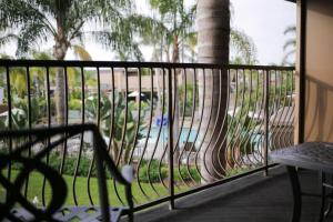a bird sitting on a railing in front of a balcony at Holiday Inn San Diego Bayside, an IHG Hotel in San Diego
