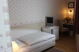 Кровать или кровати в номере Hotel Seehof Leipzig