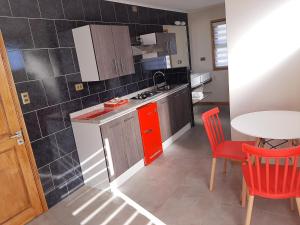 مطبخ أو مطبخ صغير في Lodging Quirinal