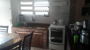 Køkken eller tekøkken på CASA PRAIA PERUÍBE PISCINA