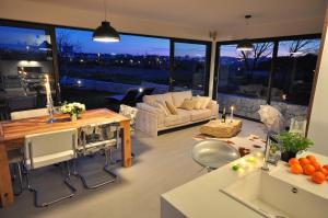 a living room with a couch and a table at Luxury Villa Luminosa in Split