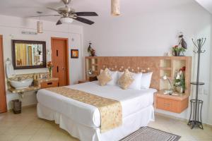 Cama o camas de una habitación en Hotel Bucaneros Isla Mujeres