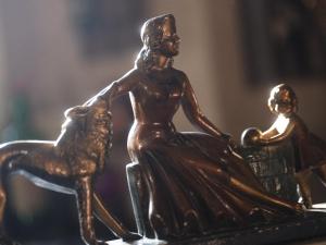 a bronze figurine of a woman and a child at Casa Falleri Boutique Hotel in Lima