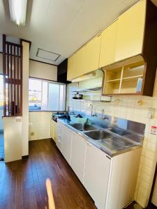A kitchen or kitchenette at KR Apartment in Kanazawa