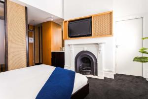 מיטה או מיטות בחדר ב-Middle Park Hotel