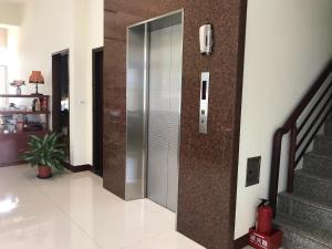 a hallway with a elevator in a house at Chishang Music Guesthouse in Chishang