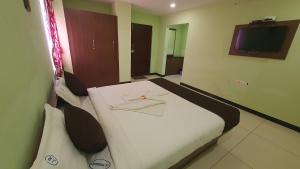 Katil atau katil-katil dalam bilik di JR Guest Home