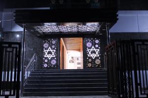 a set of stairs in a building with lights at Citi Inn in Patna