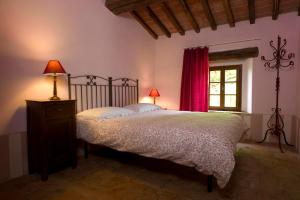 Postel nebo postele na pokoji v ubytování Agriturismo Podere Costarella