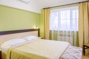 Cama o camas de una habitación en Slavia Hotel