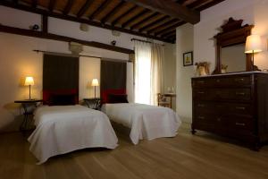 Postel nebo postele na pokoji v ubytování Agriturismo Podere Costarella