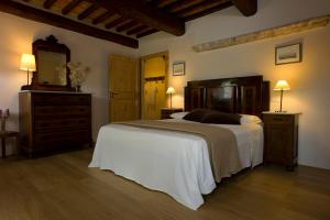 Postel nebo postele na pokoji v ubytování Agriturismo Podere Costarella