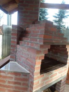 a stack of bricks on a barbecue grill at De la mare la munte in Vatra Dornei