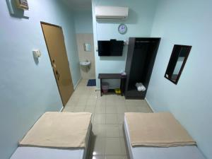 TV a/nebo společenská místnost v ubytování Hotel Permai Melaka Raya