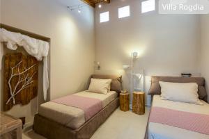 Postel nebo postele na pokoji v ubytování Atsipopoulo Villas
