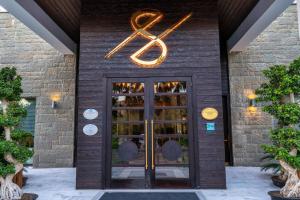 a door to a wine store with a sign above it at Hillstone Bodrum Hotel & Spa in Bodrum City