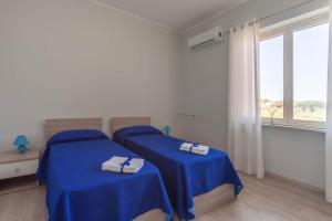 A bed or beds in a room at San Martino Holiday Apartments