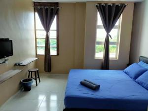 En eller flere senger på et rom på CSH Motel Kuala Perlis