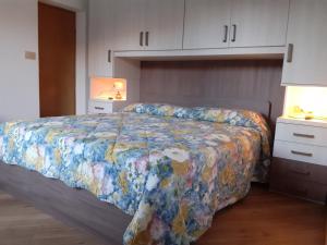 En eller flere senge i et værelse på Vacanzemoena - Casa al Parco, tipologia 1