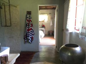 a bathroom with a flag hanging on the wall at A Boat House in Nottingham Road