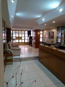 a lobby of a building with a reception desk at Maison Apart Hotel in Mar del Plata