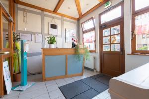 a room with a counter and a door at Blütenhotel Village in Sarnau