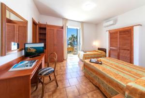 Postel nebo postele na pokoji v ubytování Hotel Citara