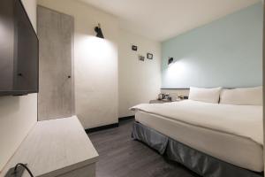 Voodi või voodid majutusasutuse Raise Hotel Taichung toas