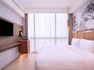 Postelja oz. postelje v sobi nastanitve Mercure Tangerang BSD City