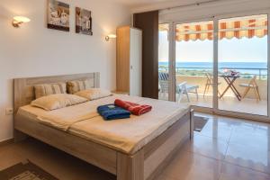 Postel nebo postele na pokoji v ubytování Montenegro Apartments Utjeha