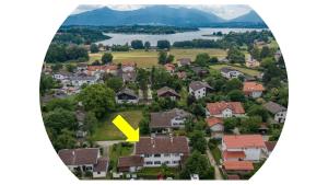 a town with a yellow arrow on top of houses at Chiemsee-Ferienhaus Schlegel in Breitbrunn am Chiemsee