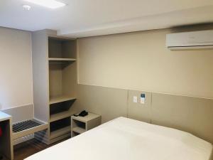 Ένα ή περισσότερα κρεβάτια σε δωμάτιο στο Hiber Hotel - Acesso a Chapecó
