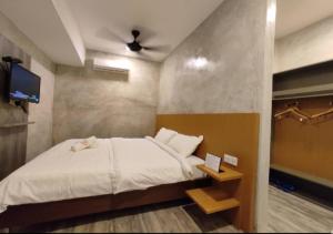Letto o letti in una camera di Rick Resort Teluk Intan