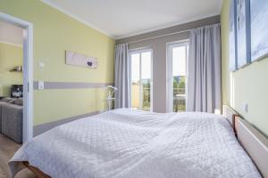 Ein Bett oder Betten in einem Zimmer der Unterkunft Villa Strandvogt