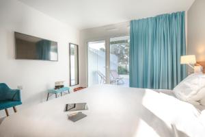 Postel nebo postele na pokoji v ubytování SOWELL HOTELS La Plage
