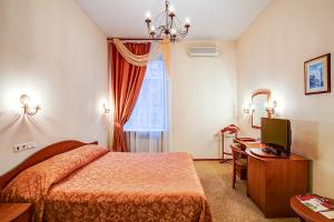 Кровать или кровати в номере Marco Polo St Petersburg Бутик-Отель 