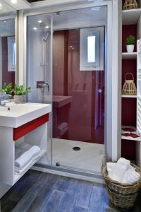 a bathroom with a shower and a sink at Résidence & Hotel U Livanti ECOLABEL in Propriano