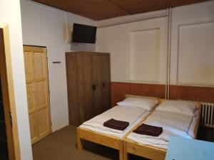Postel nebo postele na pokoji v ubytování Penzion U Hrocha