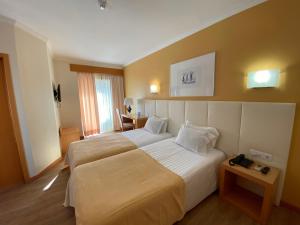 Кровать или кровати в номере Hotel Mare
