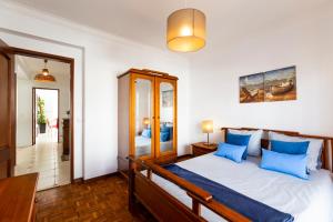 Postel nebo postele na pokoji v ubytování Ericeira Central Apartment