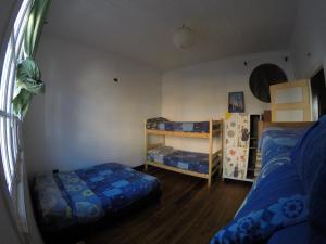Postel nebo postele na pokoji v ubytování Lemuria Hostel