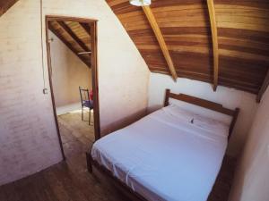 Cama o camas de una habitación en Complejo Diablo Verde Punta del Diablo