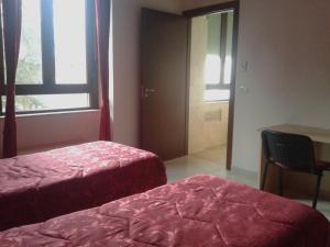 Voodi või voodid majutusasutuse Albergo Ma.Re toas
